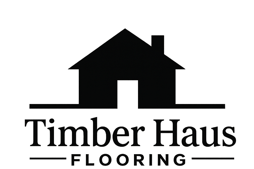 A dark logo for Timber Haus Flooring featuring a house silhouette above the text, shown on a transparent background.
